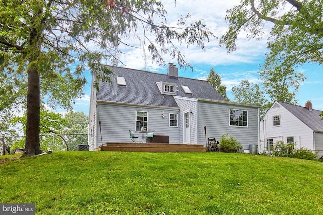 6823 Donahue Ct, Falls Church, VA 22042 - back of house featuring a wooden deck, a chimney, and roof with shingles