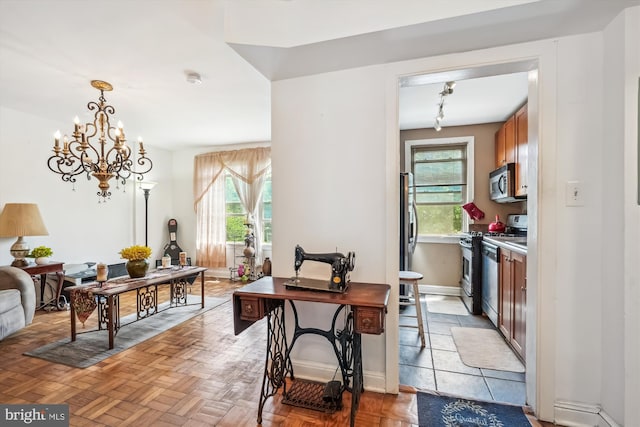 4402 1st Pl NE Unit 11, Washington, DC 20011 - dining room with healthy amount of natural light, baseboards, and a chandelier