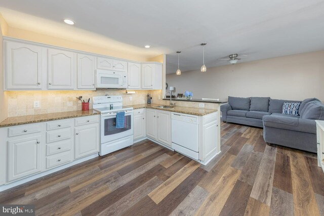 347 Paulsboro Rd, Woolwich Twp, NJ 08085 - kitchen featuring white appliances, a peninsula, white cabinetry, open floor plan, and recessed lighting