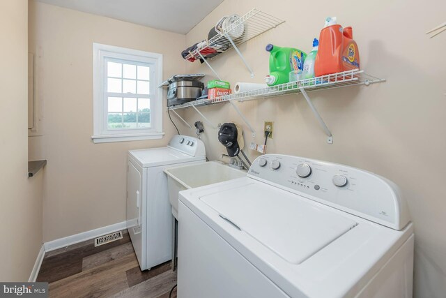 347 Paulsboro Rd, Woolwich Twp, NJ 08085 - washroom featuring dark wood-style flooring and washer and clothes dryer