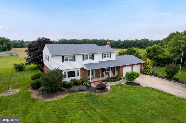 347 Paulsboro Rd, Woolwich Twp, NJ 08085 - traditional home featuring covered porch, brick siding, an attached garage, driveway, and a chimney