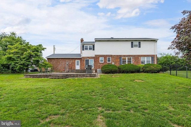 347 Paulsboro Rd, Woolwich Twp, NJ 08085 - rear view of property featuring a patio area, brick siding, and a chimney