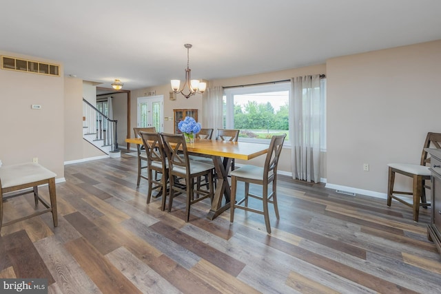 347 Paulsboro Rd, Woolwich Twp, NJ 08085 - dining area with stairs, wood finished floors, and a chandelier