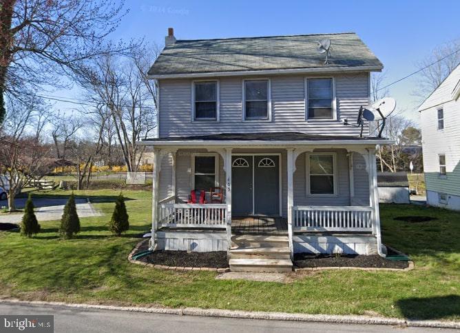 405 E S St, Kennett Square, PA 19348 - view of front of property featuring covered porch and a front lawn