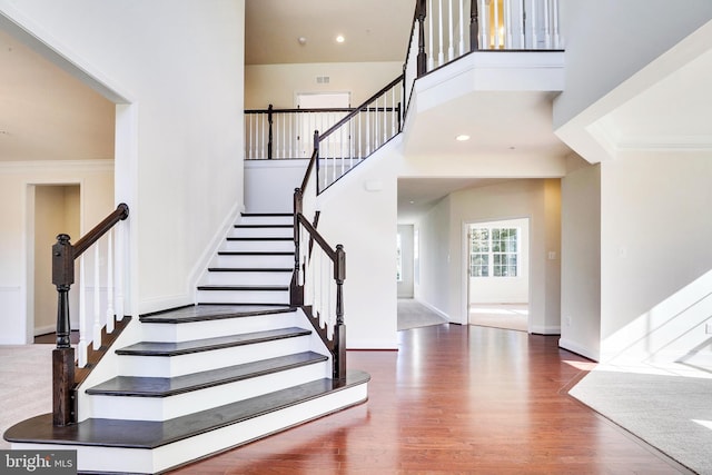 15491 Barnesville Rd, Boyds, MD 20841 - stairs with wood finished floors, baseboards, a high ceiling, and crown molding
