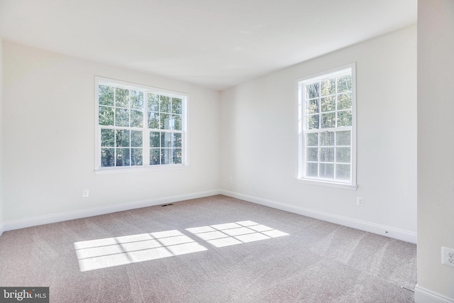 15491 Barnesville Rd, Boyds, MD 20841 - empty room featuring carpet flooring and healthy amount of natural light