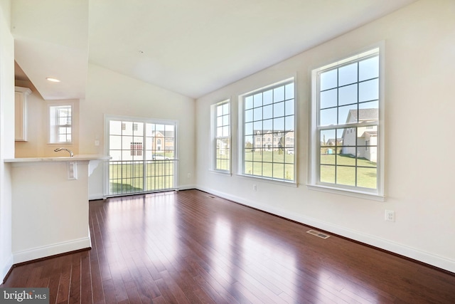 15491 Barnesville Rd, Boyds, MD 20841 - unfurnished living room with baseboards, dark wood-type flooring, and vaulted ceiling