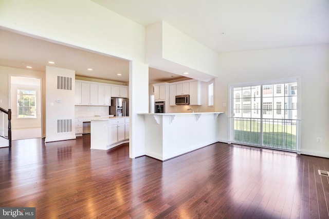 15491 Barnesville Rd, Boyds, MD 20841 - unfurnished living room with dark wood-style floors, recessed lighting, and baseboards