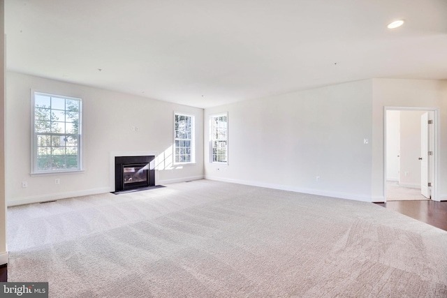 15491 Barnesville Rd, Boyds, MD 20841 - unfurnished living room featuring carpet flooring, healthy amount of natural light, baseboards, a fireplace with flush hearth, and recessed lighting