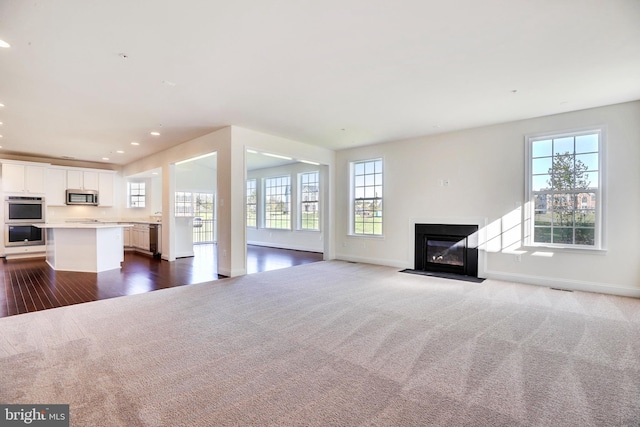 15491 Barnesville Rd, Boyds, MD 20841 - unfurnished living room with plenty of natural light, a fireplace with flush hearth, baseboards, and recessed lighting