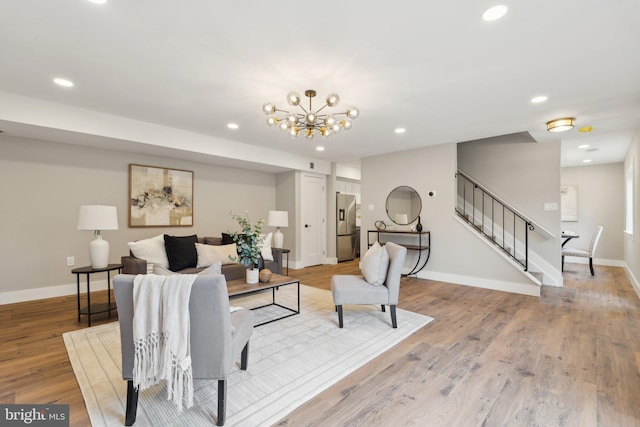 4536 Conwell Dr, Annandale, VA 22003 - living area with stairway, recessed lighting, light wood finished floors, baseboards, and a chandelier