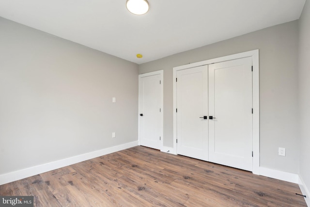 4536 Conwell Dr, Annandale, VA 22003 - unfurnished bedroom featuring baseboards, wood finished floors, and a closet
