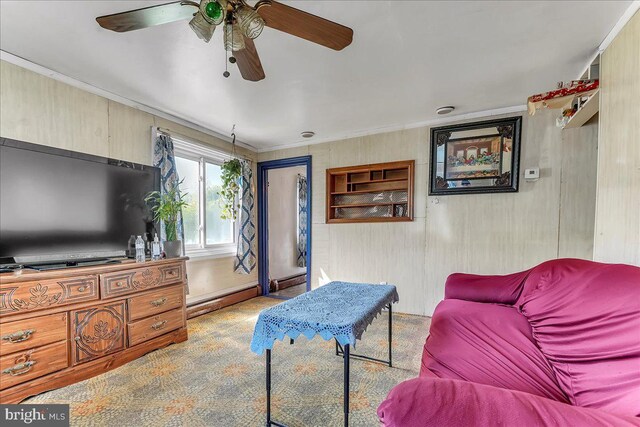 315 Mcginn Pl, New Castle, DE 19720 - living room featuring a ceiling fan, a baseboard radiator, ornamental molding, and wood walls