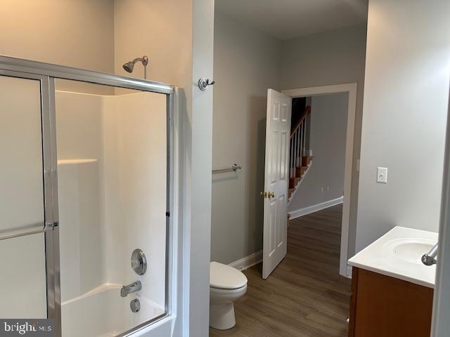 27 Kleis Rd, Severna Park, MD 21146 - full bath featuring toilet, vanity, wood finished floors, enclosed tub / shower combo, and baseboards