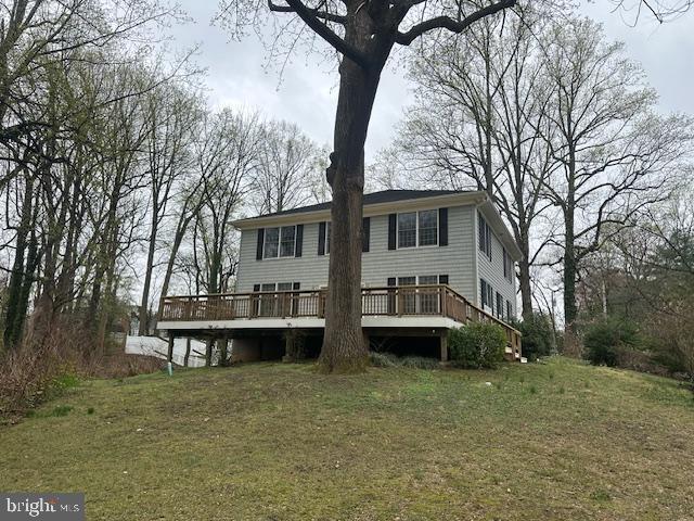 27 Kleis Rd, Severna Park, MD 21146 - back of house featuring a deck and a lawn