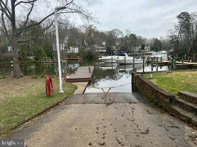 27 Kleis Rd, Severna Park, MD 21146 - dock area featuring a boat ramp, a water view, and a yard
