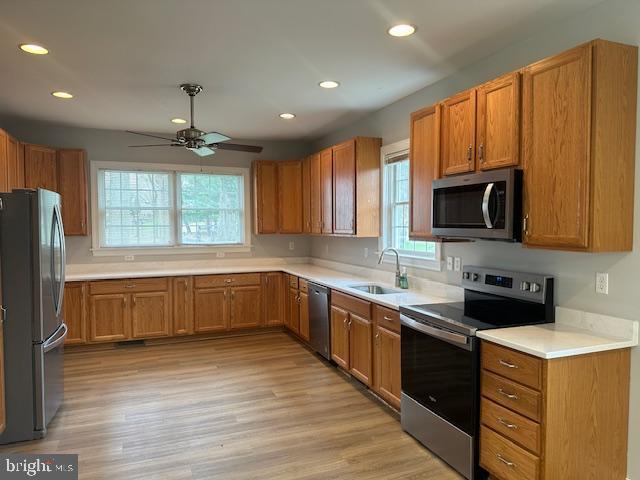 27 Kleis Rd, Severna Park, MD 21146 - kitchen featuring stainless steel appliances, a sink, recessed lighting, a ceiling fan, and brown cabinetry