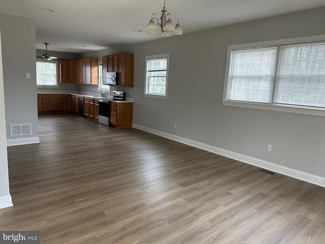 27 Kleis Rd, Severna Park, MD 21146 - kitchen with appliances with stainless steel finishes, a sink, baseboards, a chandelier, and light countertops