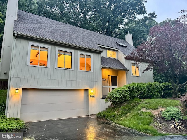 11212 Angus Pl, Potomac, MD 20854 - view of front of home with a chimney, roof with shingles, a garage, and driveway