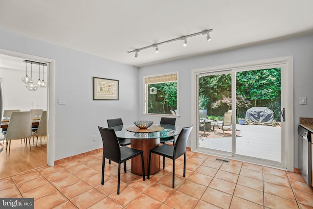 11212 Angus Pl, Potomac, MD 20854 - dining space with a chandelier, light tile patterned flooring, and rail lighting
