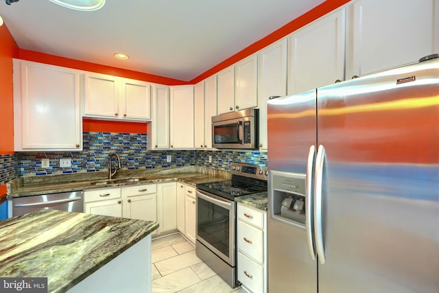 1713 Sea Pine Cir, Severn, MD 21144 - kitchen featuring stainless steel appliances, a sink, white cabinetry, dark stone counters, and recessed lighting
