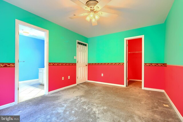 1713 Sea Pine Cir, Severn, MD 21144 - unfurnished bedroom with carpet floors, a spacious closet, a closet, baseboards, and ensuite bath
