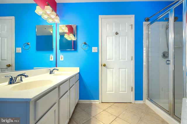 1713 Sea Pine Cir, Severn, MD 21144 - full bath featuring tile patterned flooring, baseboards, a stall shower, and double vanity