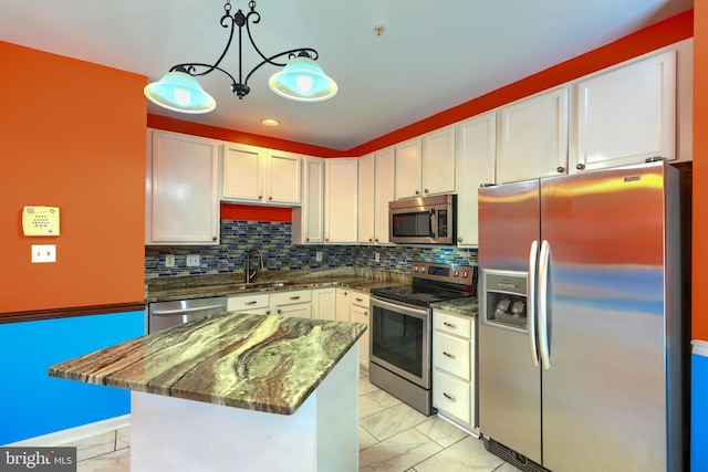 1713 Sea Pine Cir, Severn, MD 21144 - kitchen with appliances with stainless steel finishes, light marble finish floors, white cabinetry, dark stone counters, and recessed lighting