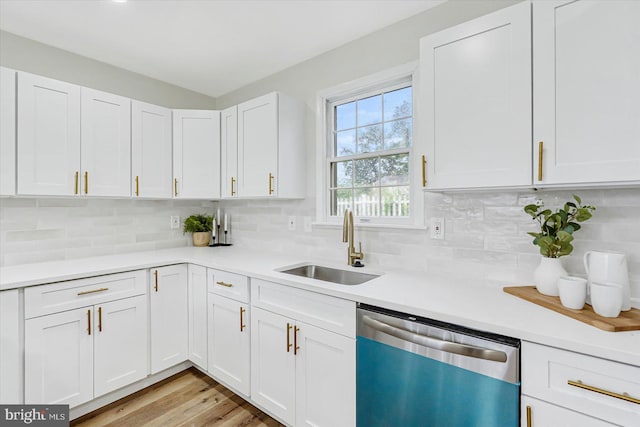 5507 Heatherwood Rd, Baltimore, MD 21227 - kitchen with dishwasher, a sink, light countertops, and white cabinets