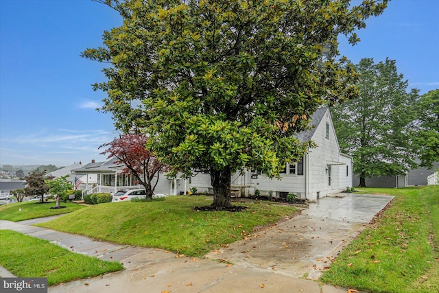 5507 Heatherwood Rd, Baltimore, MD 21227 - obstructed view of property with a front yard and a shingled roof