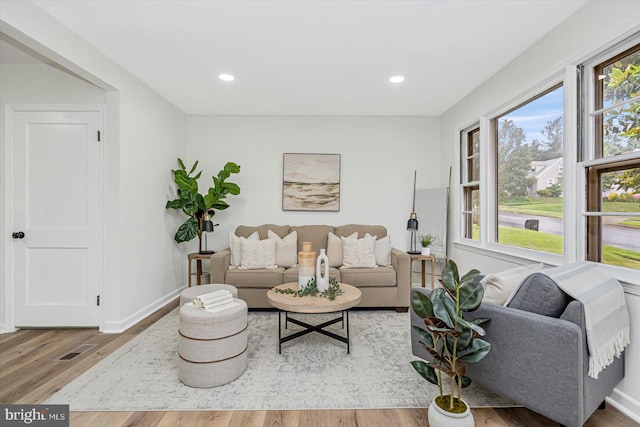 5507 Heatherwood Rd, Baltimore, MD 21227 - living room with light wood-style floors, baseboards, and recessed lighting
