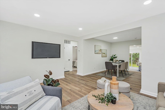5507 Heatherwood Rd, Baltimore, MD 21227 - living area featuring light wood-type flooring, baseboards, and recessed lighting
