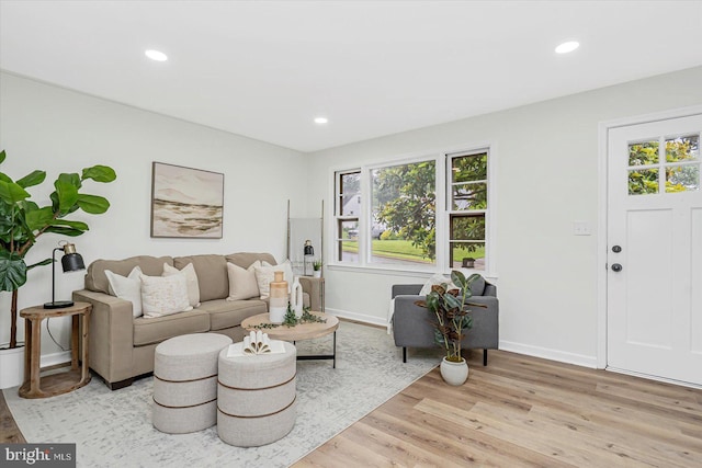 5507 Heatherwood Rd, Baltimore, MD 21227 - living room with healthy amount of natural light, light wood-style flooring, baseboards, and recessed lighting