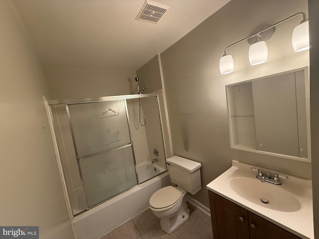 9200 Bridle Path Ln Unit E, Laurel, MD 20723 - bathroom with vanity, toilet, bath / shower combo with glass door, tile patterned flooring, and baseboards