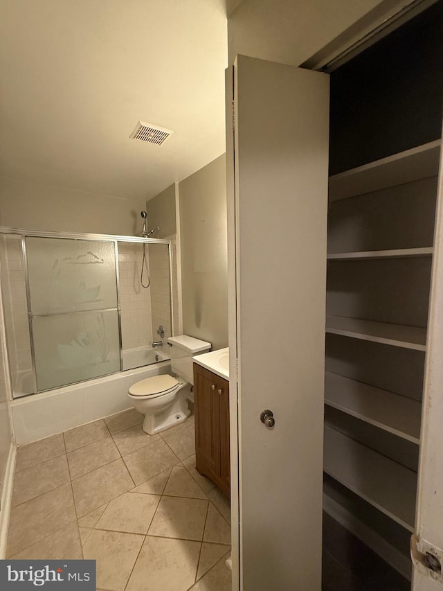 9200 Bridle Path Ln Unit E, Laurel, MD 20723 - bathroom with combined bath / shower with glass door, vanity, tile patterned flooring, and toilet