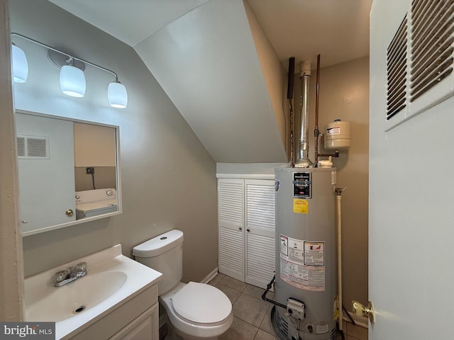 9200 Bridle Path Ln Unit E, Laurel, MD 20723 - bathroom featuring water heater, toilet, vanity, tile patterned floors, and lofted ceiling