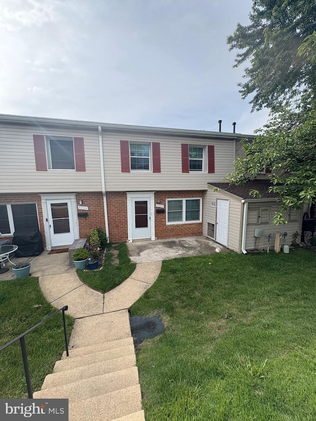 9200 Bridle Path Ln Unit E, Laurel, MD 20723 - multi unit property featuring brick siding and a front lawn