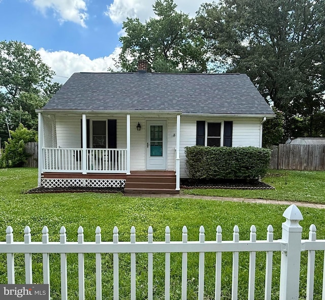 2312 Oak St, Fredericksburg, VA 22401 - view of front facade with covered porch, a chimney, and roof with shingles