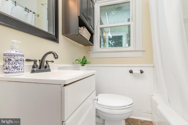 2312 Oak St, Fredericksburg, VA 22401 - bathroom featuring vanity, a wainscoted wall, and shower / bath combination with curtain