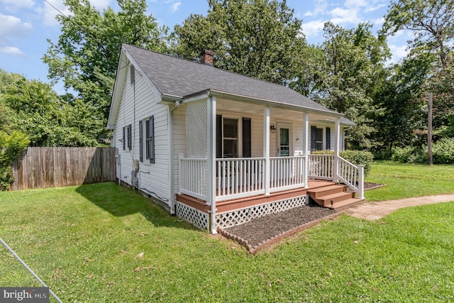2312 Oak St, Fredericksburg, VA 22401 - view of front of home with covered porch, a chimney, and a shingled roof