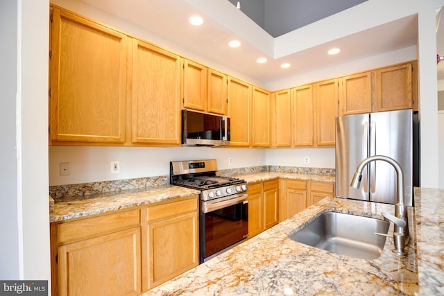 6549 Grange Ln Unit 401, Alexandria, VA 22315 - kitchen with stainless steel appliances, recessed lighting, a sink, light stone counters, and light brown cabinets