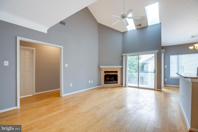 6549 Grange Ln Unit 401, Alexandria, VA 22315 - unfurnished living room featuring high vaulted ceiling, a ceiling fan, a fireplace, light wood-type flooring, and baseboards