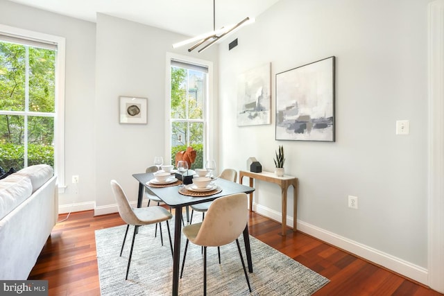 531 T St NW Unit 101, Washington, DC 20001 - dining room featuring baseboards, wood finished floors, and a chandelier