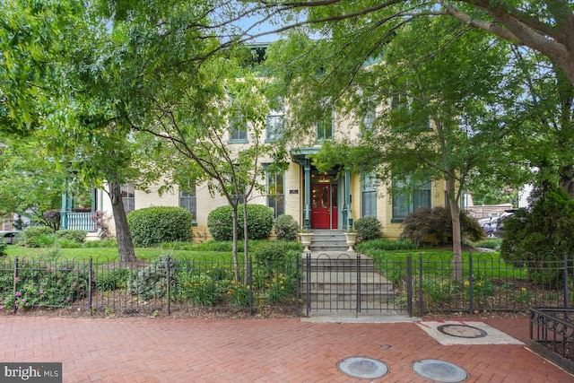 531 T St NW Unit 101, Washington, DC 20001 - obstructed view of property featuring a fenced front yard, a gate, and brick siding