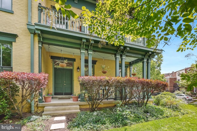 531 T St NW Unit 101, Washington, DC 20001 - view of exterior entry with a balcony, a porch, and brick siding