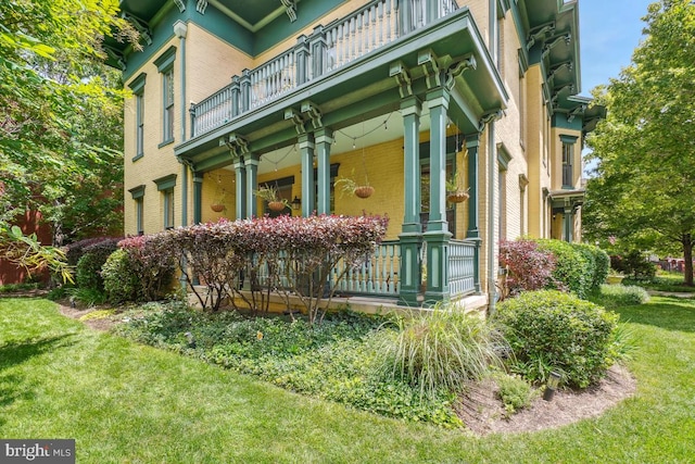 531 T St NW Unit 101, Washington, DC 20001 - entrance to property with a balcony, covered porch, a lawn, and brick siding