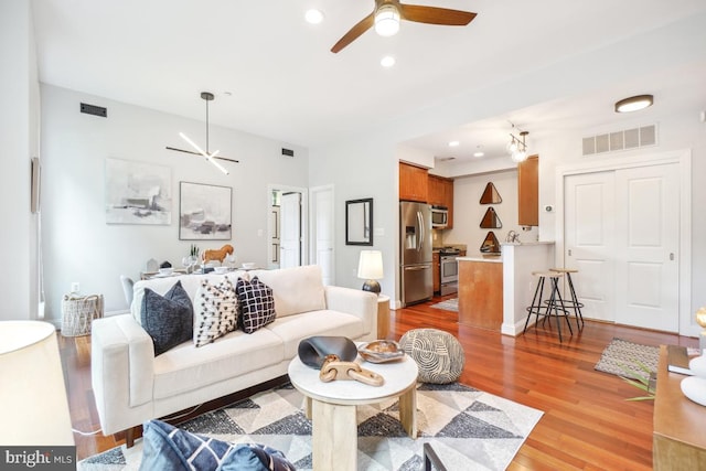 531 T St NW Unit 101, Washington, DC 20001 - living area with ceiling fan, wood finished floors, and recessed lighting