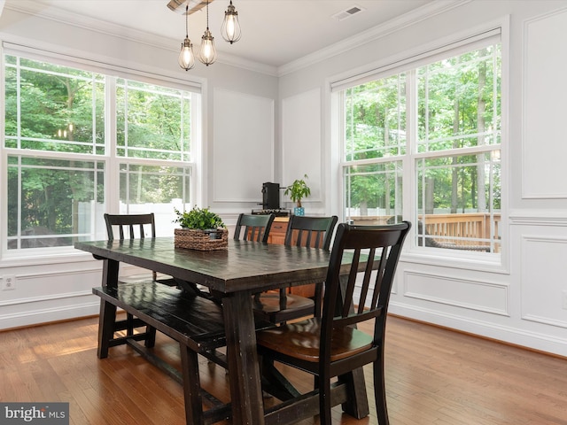 933 Winding Rd, Edgewater, MD 21037 - dining room with light wood-style floors, ornamental molding, and a decorative wall