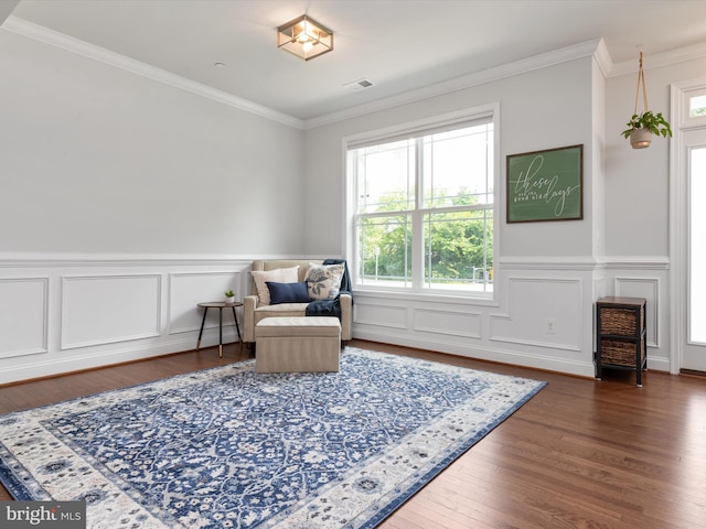 933 Winding Rd, Edgewater, MD 21037 - sitting room with plenty of natural light, wood finished floors, crown molding, a decorative wall, and wainscoting