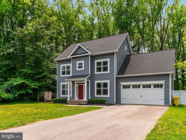 933 Winding Rd, Edgewater, MD 21037 - view of front of home with an attached garage, asphalt driveway, and roof with shingles